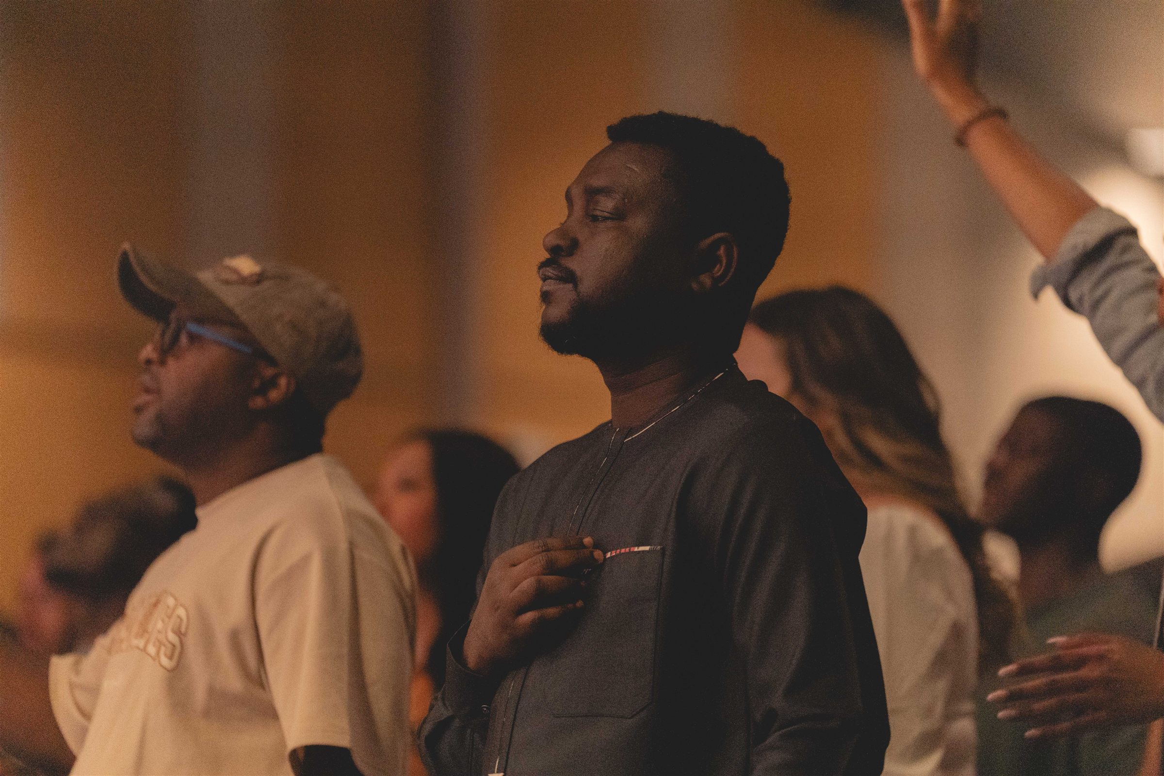 A diverse crowd worshipping together